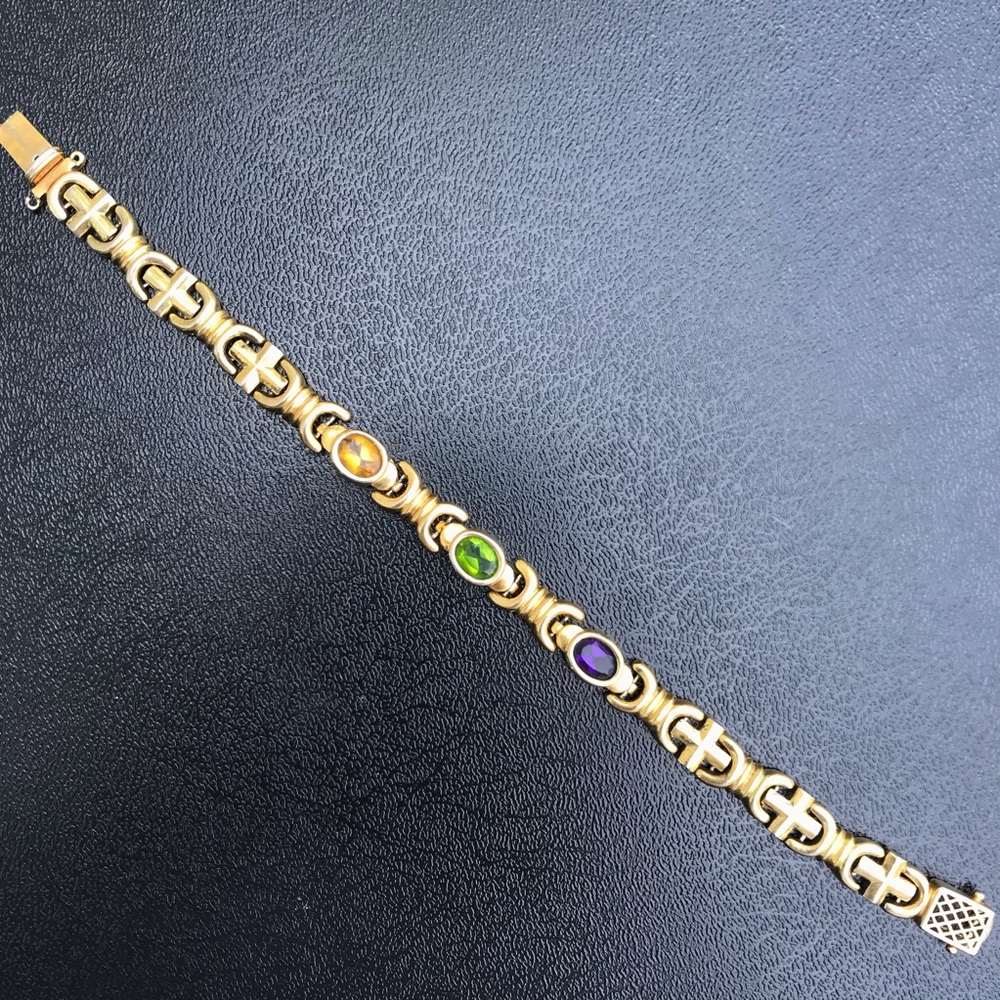Gold bracelet with colored jewels